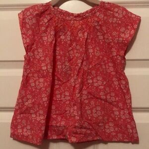 Jacadi girl top, orange with white flowers, ornamental stitched neck, size 6